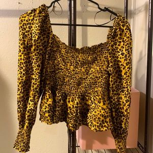 Francesca’s cheetah print shirt, slightly cropped size XL fits tight